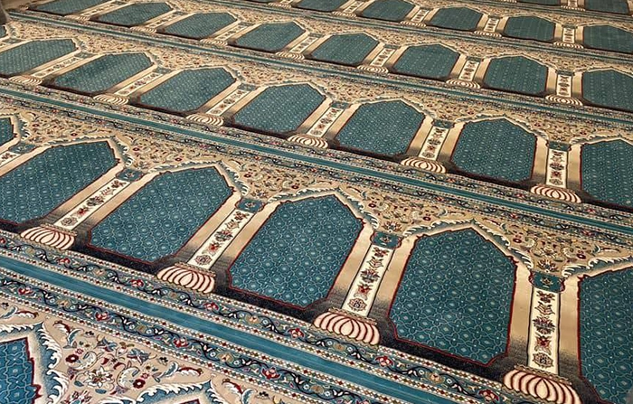 Wholesale prayer rugs being prepared for export to UAE and Saudi Arabia